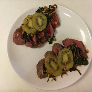 Rare center cut sirloin topped with sauteed spinach, walnuts, and onions served with caramelized kiwi